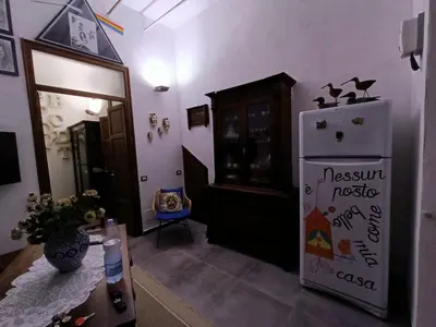 a kitchen with a refrigerator in a room at Syd's House in Bagheria