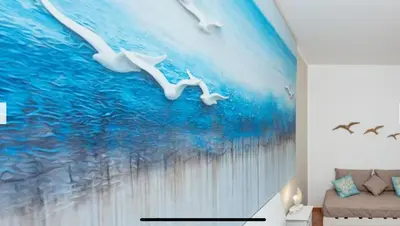 two seagulls flying in the water mural at Blue Coral in San Vito lo Capo