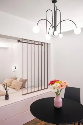 a room with a table with a bed in the background at A Casa di Giulia - elegante loft in centro storico in Palermo