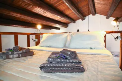 a bed with two towels on top of it at Cattedrale - VISTA HOUSE easy parking in Palermo