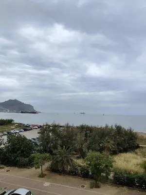 a view of the ocean from a parking lot at Casa Josè Suite Mare in Palermo