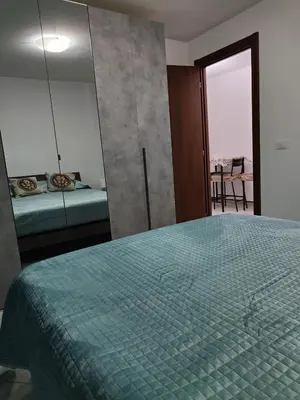 a bedroom with a large bed and a mirror at Casa Josè Suite Mare in Palermo