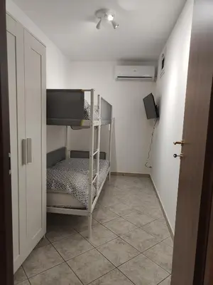 a small room with a bunk bed and a hallway at Casa Josè Suite Mare in Palermo