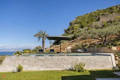 a view of a house with a hill at Sea View Villa whit Pool in Scopello