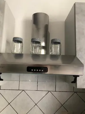 a counter with three glass jars on top of it at Case Billeci Casa blu in Palermo
