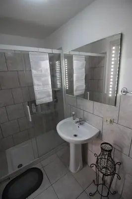 a bathroom with a sink and a shower at Case Billeci Casa blu in Palermo