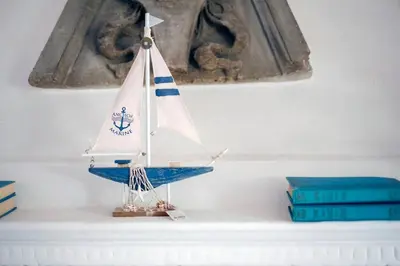 a toy boat sitting on top of a mantle at Villa Marina Sant'Elia in Santa Flavia