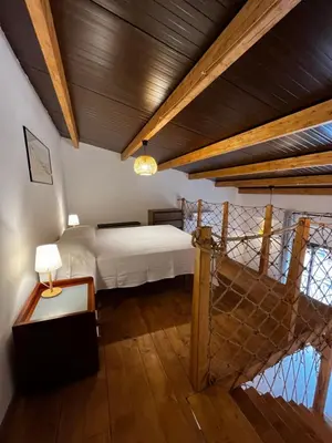 a bedroom with a bed and a wooden ceiling at A casa del Conte in Palermo