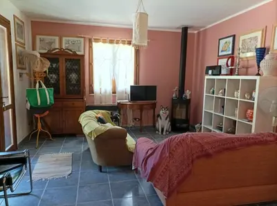 a bedroom with a bed and a dog in it at Villetta sulla Valle in Castellammare del Golfo