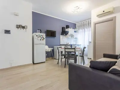a kitchen and living room with a refrigerator and a table at Apartment La Casetta di Clò by Interhome in Palermo