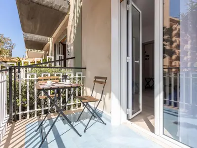 a balcony with a table and chairs on it at Apartment La Casetta di Clò by Interhome in Palermo