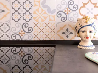 a vase sitting on a table in a room with wallpaper at Apartment La Casetta di Clò by Interhome in Palermo