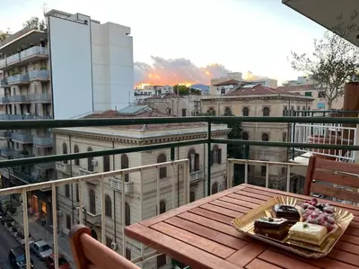 a plate of food on a table on a balcony at Casa Lov (Politeama) in Palermo