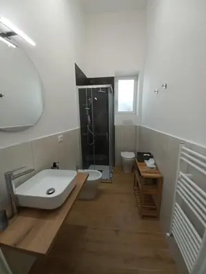 a bathroom with a sink and a toilet and a shower at Casa Ranzano in Palermo