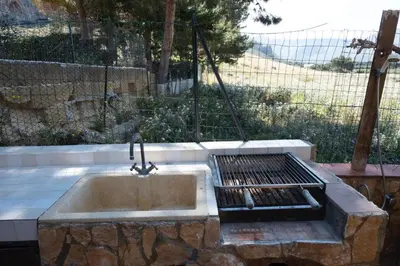 a kitchen sink with a grill and a grill at Casa Sally con Vista Mare a Macari in Macari