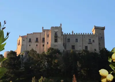a castle on top of a hill with trees at Il Moro in Carini