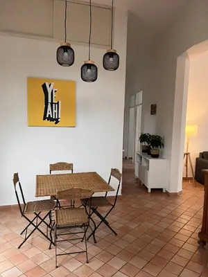 a dining room with a table and chairs at The k house in Palermo