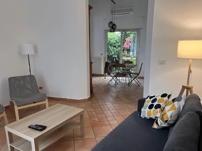 a living room with a couch and a table at The k house in Palermo