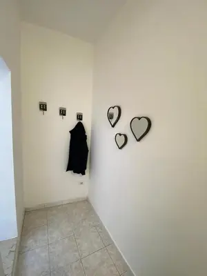a room with two hearts on a wall at Al Parlatoio del Centro Storico in Palermo