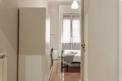 a small room with a table and a bed at LA VECCHIA PALERMO in Palermo