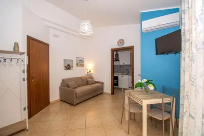 a living room with a couch and a table at La Dimora di David in Bagheria