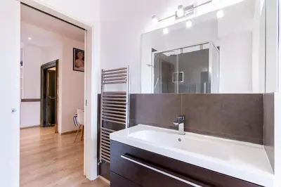 a bathroom with a sink and a mirror at Eye on the Politeama - L'occhio sul Politeama in Palermo