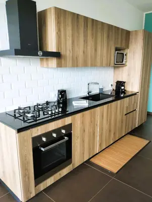 a kitchen with a stove and a sink at TorreNormanna Prestige House near Cefalù in Mandra Capreria
