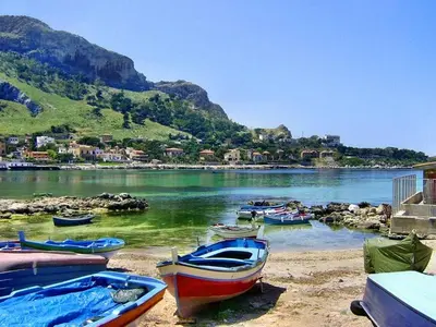 a group of boats on the shore of a body of water at - Palermo - Sferracavallo sul mare in Palermo