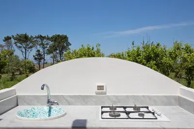 a kitchen with a sink and a stove at verdemare in relax in Cefalù
