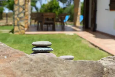 a stack of three rocks sitting on top of a rock pile at verdemare in relax in Cefalù