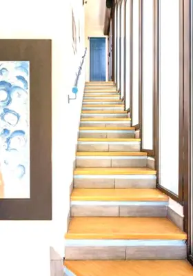 a staircase in a building with wooden floors and a blue door at Villa Mondello Terraces & Jacuzzi in Mondello