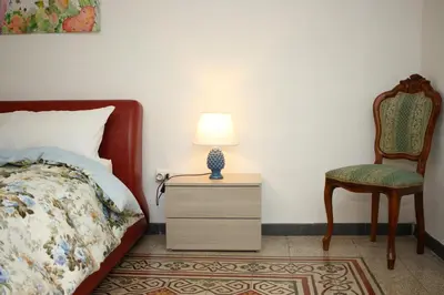 a bed with towels sitting on top of it at Colonna House Casa vacanze tra la Zisa e la Cattedrale in Palermo