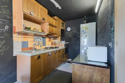 a kitchen with a sink and a refrigerator at Ballarò Market Street Art Stylish Flat x10 in Palermo