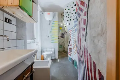 a bathroom with an american flag mural on the wall at Ballarò Market Street Art Stylish Flat x10 in Palermo