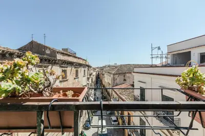a view of an alley from a balcony at Ballarò Market Street Art Stylish Flat x10 in Palermo