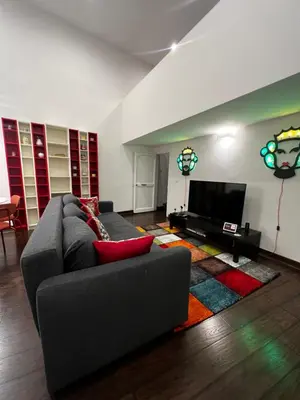 a living room with a couch and a flat screen tv at Appartamento Beatrice in Palermo