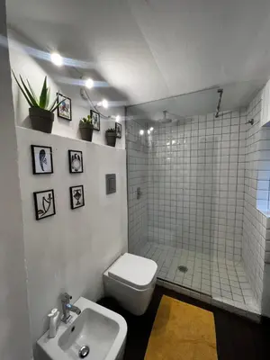 a bathroom with a toilet and a shower and a sink at Appartamento Beatrice in Palermo