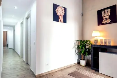 a hallway of a home with white walls and a fireplace at [The historical center of Palermo] La Dolce Vita in Palermo