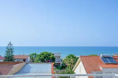 a view of the ocean from the balcony of a house at Battigia Casa Vacanze-Alcamo Marina in Alcamo Marina