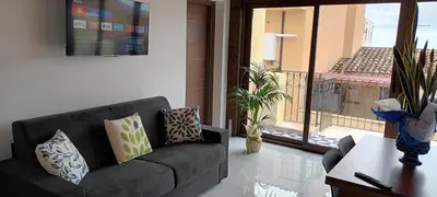 a living room with a couch and a balcony at Palazzo DS in Castellammare del Golfo