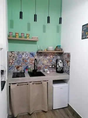 a kitchen with a sink and a counter top at ZA HOUSE in Palermo
