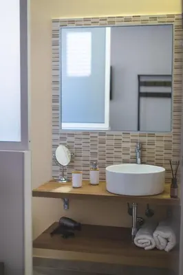 a bathroom with a sink and a mirror at ZA HOUSE in Palermo