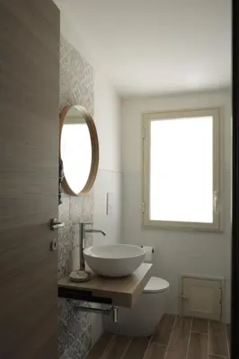 a bathroom with a sink and a mirror at Sikelìa Bed & Breakfast in Carini