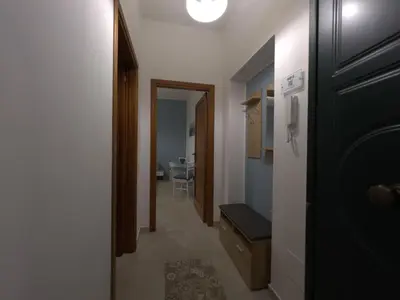 a hallway with a door leading to a room at La Capinera Holidays in Santa Flavia