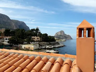 a view of the ocean from the roof of a building at La Capinera Holidays in Santa Flavia