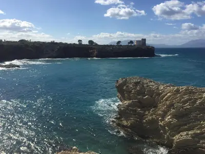 a view of the ocean from a rocky shore at Case Saniela in Terrasini
