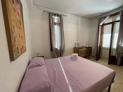 a bedroom with a bed and a table with a cup on it at Dai Maestri Rubino in Vita