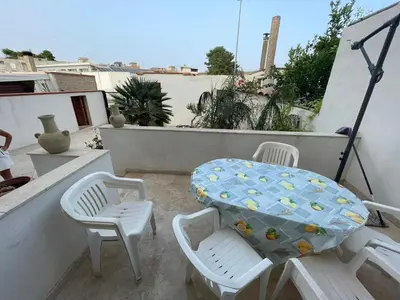 a table and two chairs on a balcony with a table at Dai Maestri Rubino in Vita