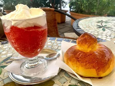 a drink and a pastry on a table at Dai Maestri Rubino in Vita