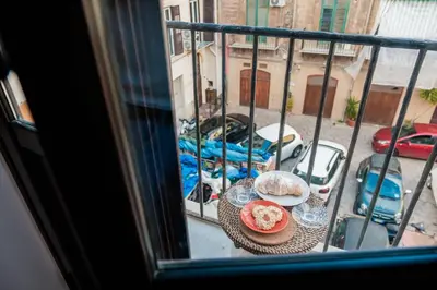 a view of a table with food on a balcony at caZÁ ~ Palermo in Palermo